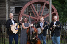 The Hunt Family Band in front of a mill - horizontal